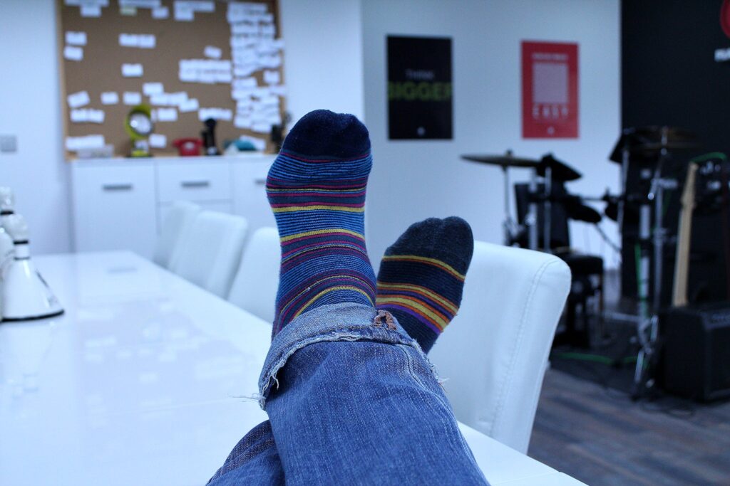 Person Wearing Blue Black Yellow Red Socks