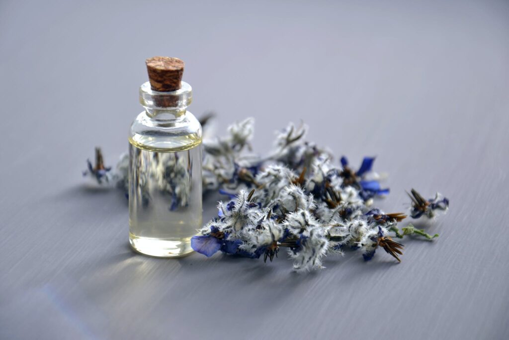 Selective Focus Photo of Bottle With Cork Lid essential oil blend for sleep